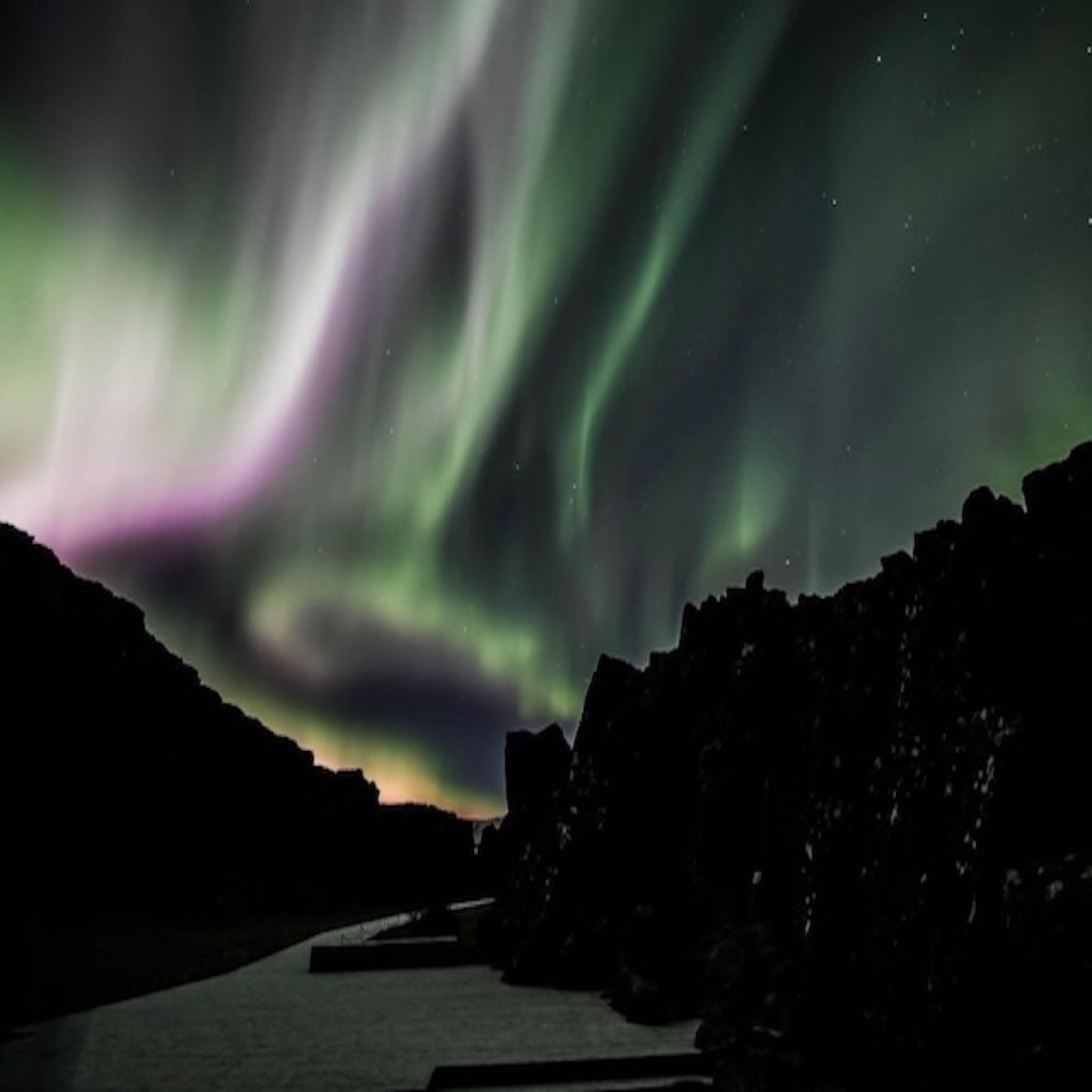 Northern Lights dancing over the Icelandic night sky